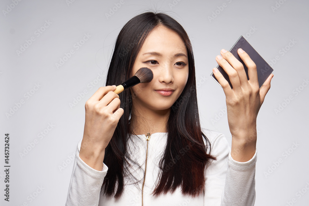 woman with brush and make-up mirror woman with brush and make-up mirror