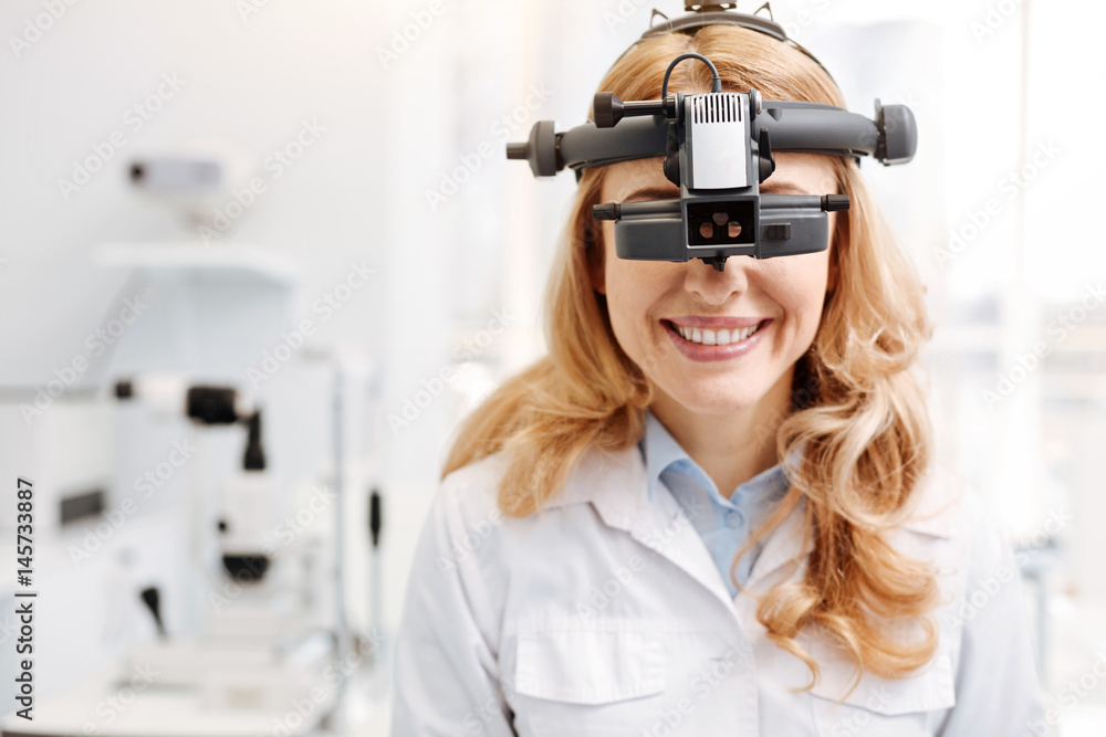 Trained talented ophthalmologist getting used to new equipment Trained talented ophthalmologist getting used to new equipment
