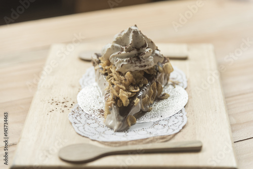 cake on wooden plate in coffee shop