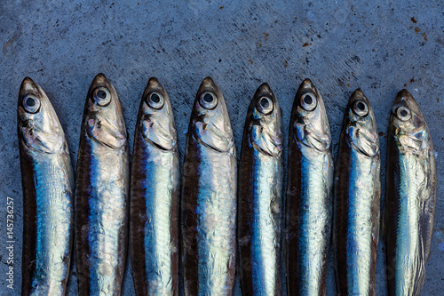 Fototapeta Fresh fish anchovy background