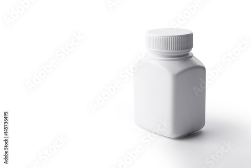 White plastic medicine bottle on white background