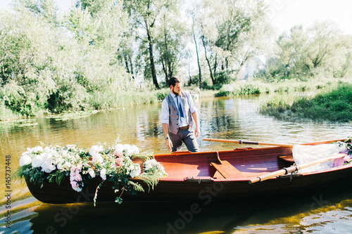 Handsome groom on the boat