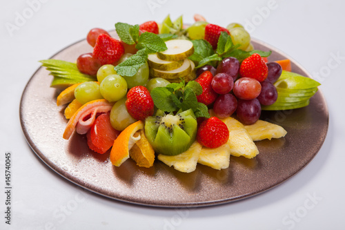 Mixed Fruit platter with assorted fruits on a white background