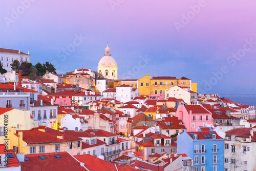 Scenic view of Alfama, the oldest district of the Old Town, with National Pantheon at pink sunset, Lisbon, Portugal
