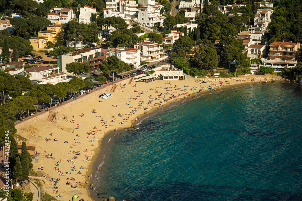 Aerial view of Canyelles beach in the city of Roses, on the Costa brava at sunset