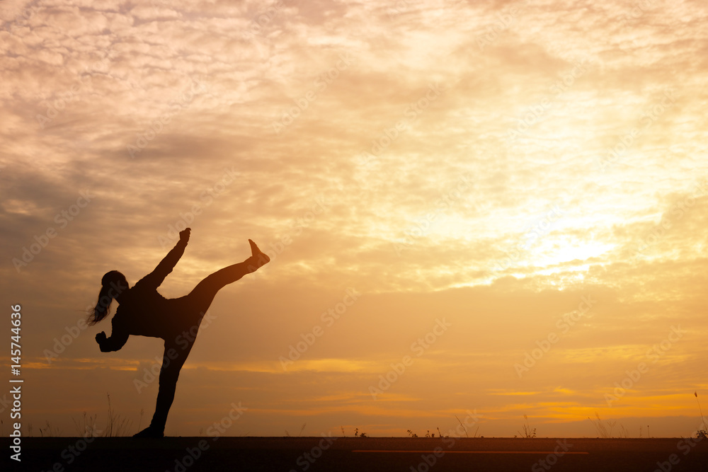 Silhouette man relaxing by martial arts