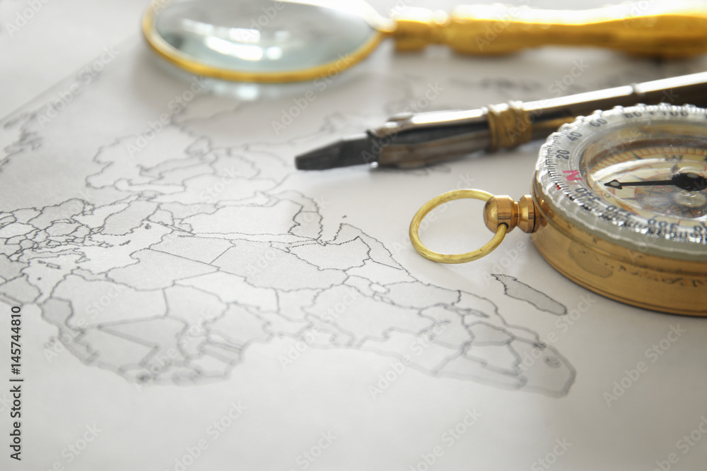Image of map, magnifying glass and old compass. selective focus Image of map, magnifying glass and old compass. selective focus