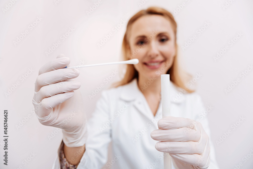 Focused on cotton stick photo that is shown on the foreground Focused on cotton stick photo that is shown on the foreground