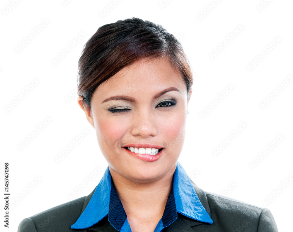 Portrait of a young businesswoman winking over white background Portrait of a young businesswoman winking over white background