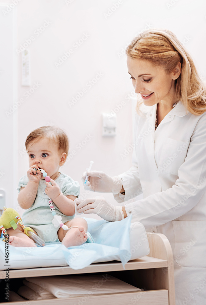 Photo of attractive woman holding syringe in right hand Photo of attractive woman holding syringe in right hand