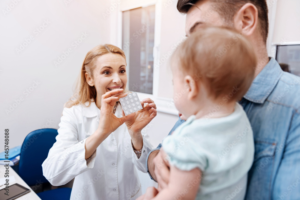 Back side of little patient while looking at nurse Back side of little patient while looking at nurse