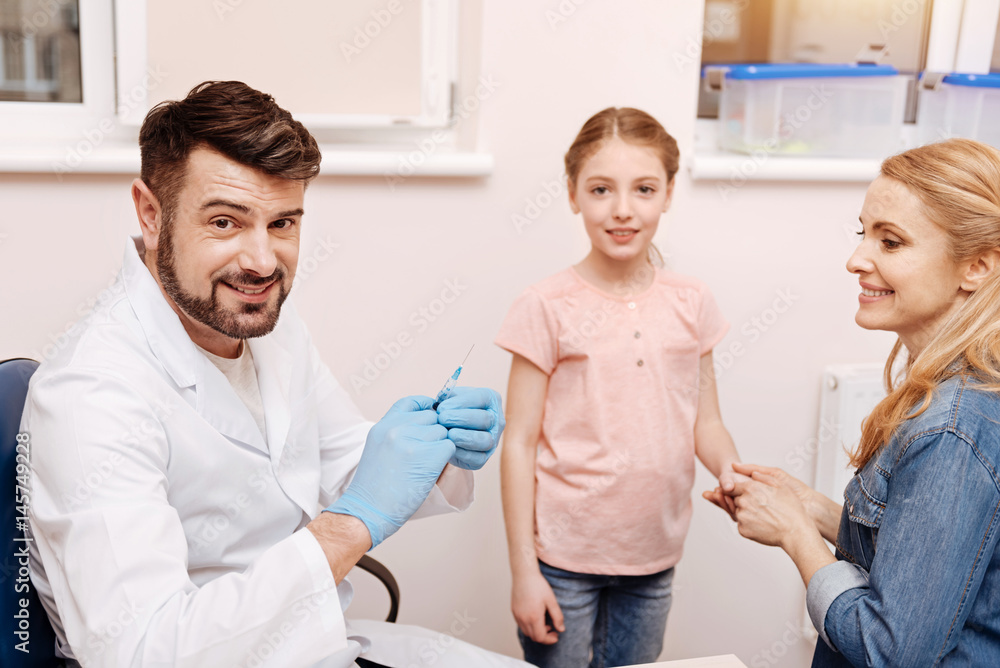 Fototapeta premium Positive delighted doctor smiling on camera