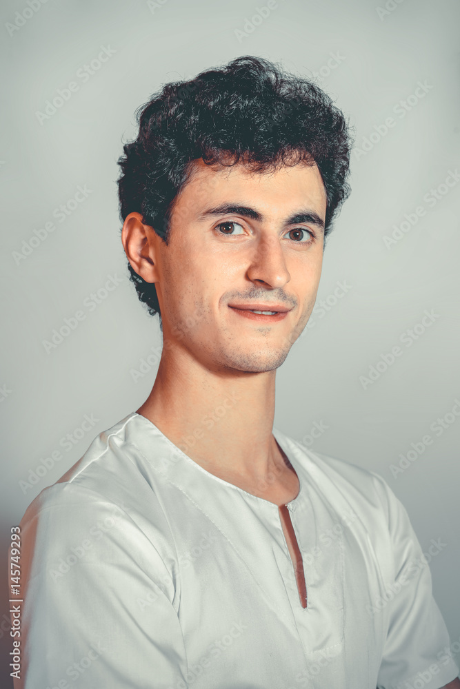Close up Portrait Of Masseur In Spa Salon. Handsome young white man doctor looking at camera. Physical Therapist. Beauty Treatment, Massage Therapy. Healthcare, Medicine Concept. Wellness, Lifestyle. Close up Portrait Of Masseur In Spa Salon. Handsome young white man doctor looking at camera. Physical Therapist. Beauty Treatment, Massage Therapy. Healthcare, Medicine Concept. Wellness, Lifestyle.