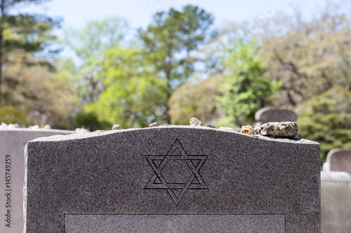 Headstone in Jewish Cemetery with Star of David and Memory Stones