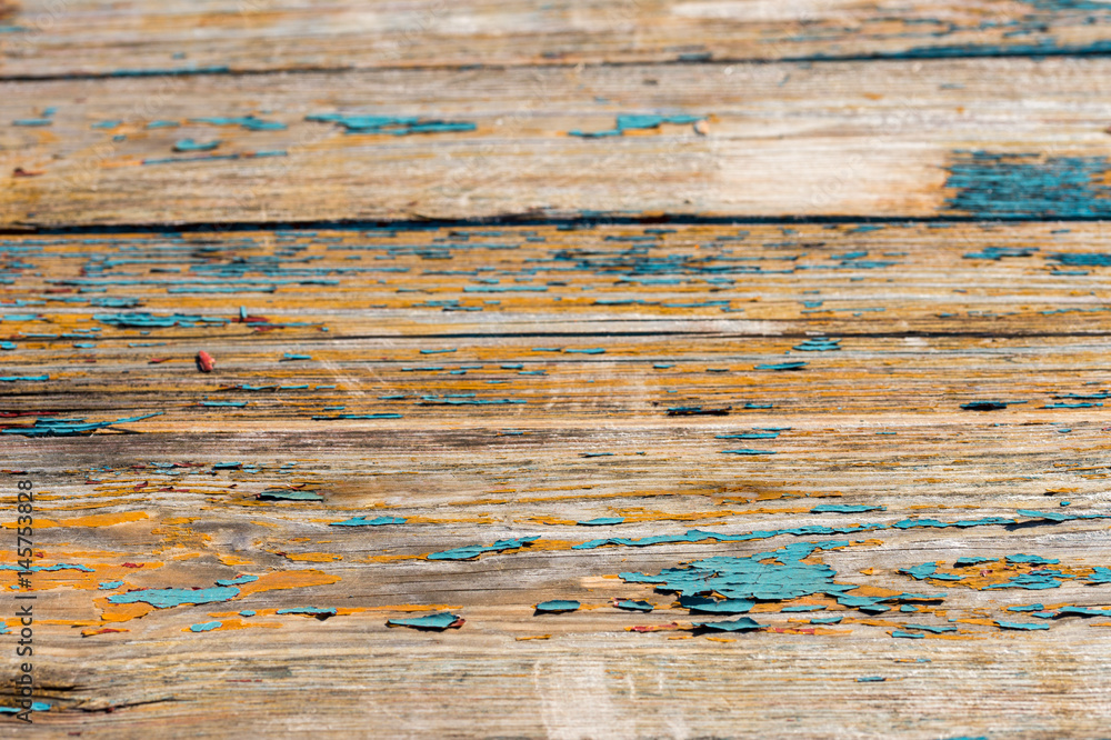 Fototapeta premium Peeling paint from a wooden table
