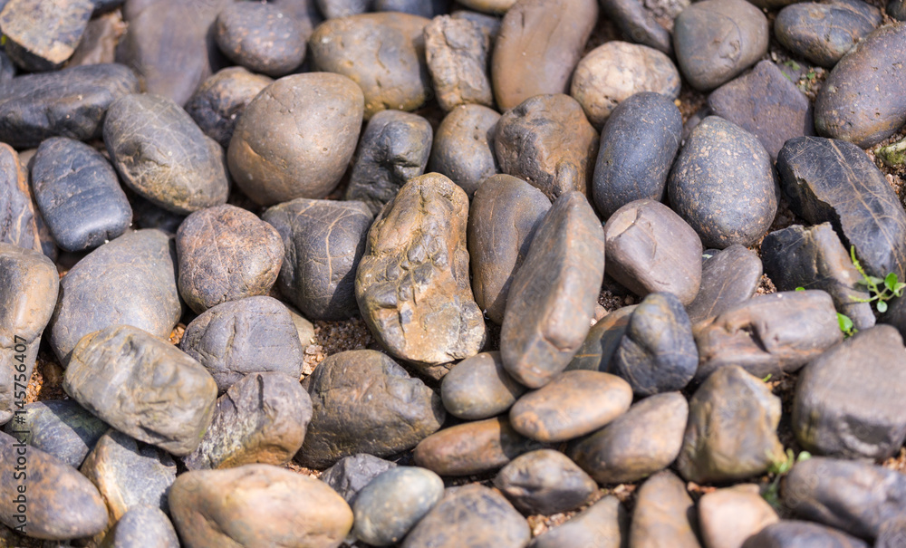 Stones Texture Background. Top View of River Stones or Rocks Surface. Close Up Macro View with Copy Space for Text or image Stones Texture Background. Top View of River Stones or Rocks Surface. Close Up Macro View with Copy Space for Text or image