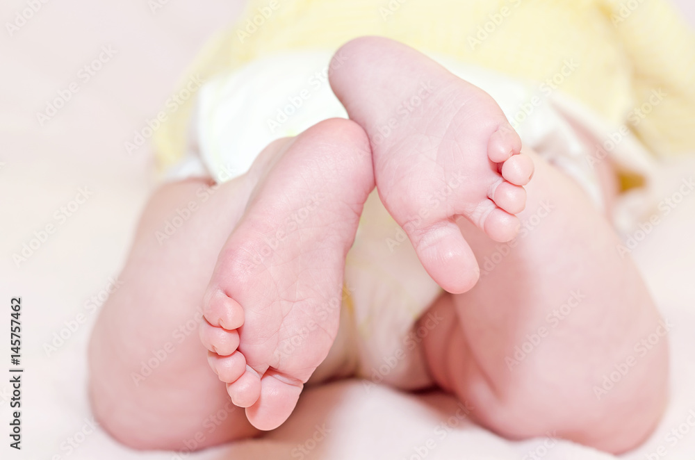 Little feet on the blanket, close-up, selective focus