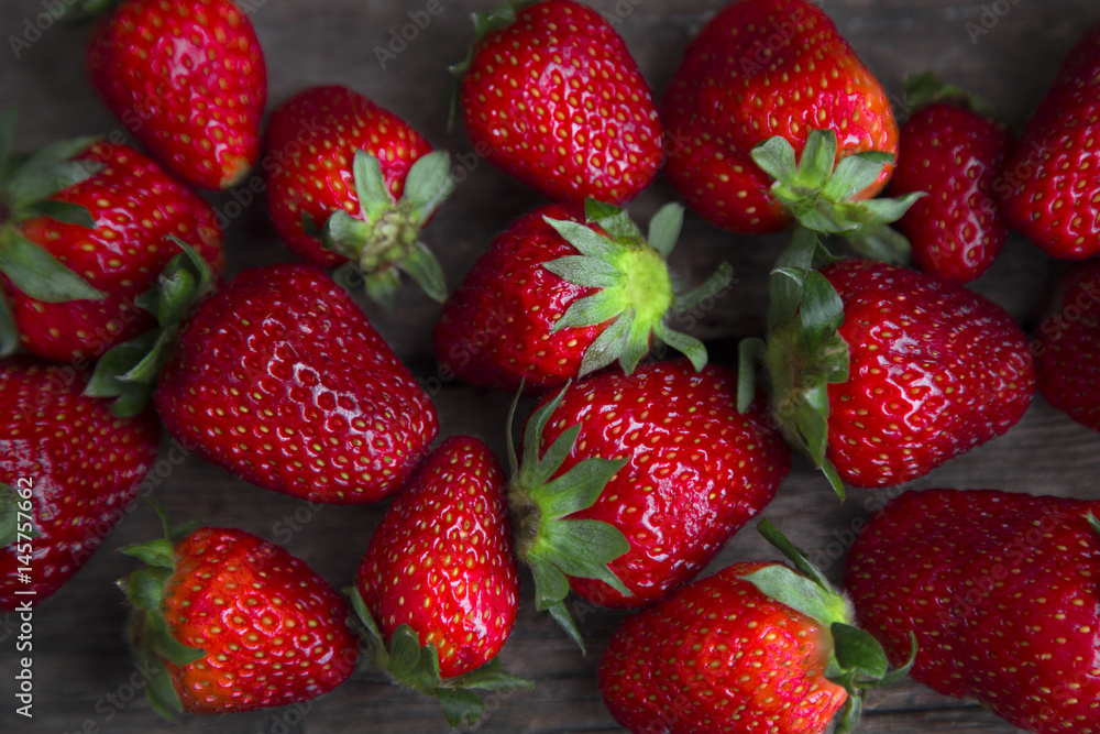 fresh strawberries on old wooden background fresh strawberries on old wooden background
