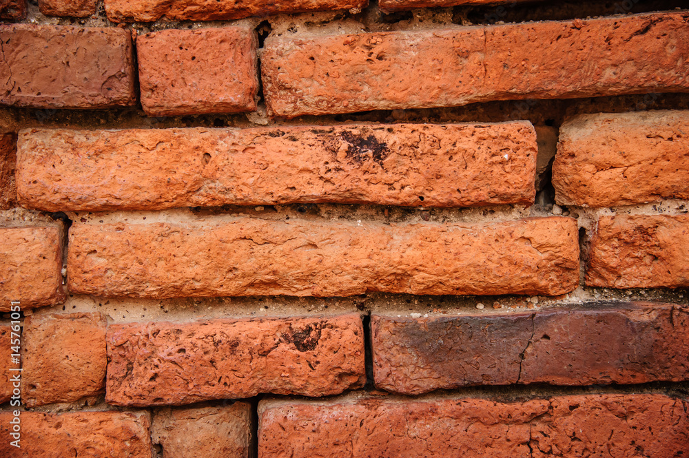 Obraz premium Close-up surface of old red brick wall. Red brick wall surface for background
