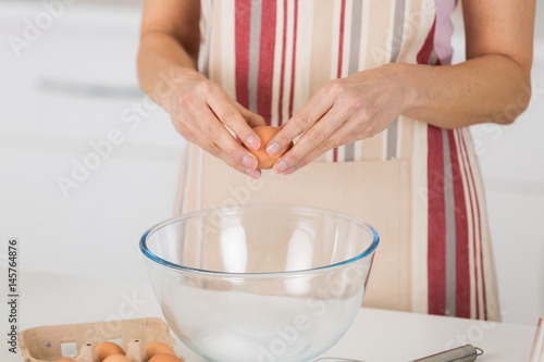 mature woman cooking tart for her family