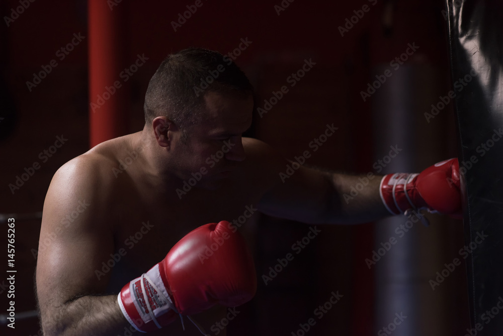 kick boxer training on a punching bag