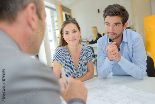 Young couple in meeting with property developer