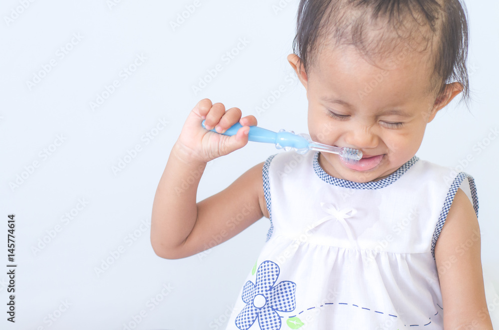 Asian baby girl with tooth brush Asian baby girl with tooth brush