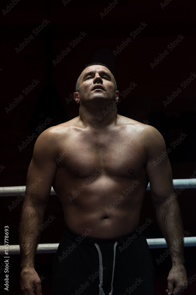 portrait of muscular professional kickboxer