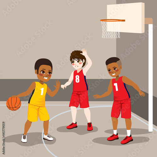 Young boys playing basketba...