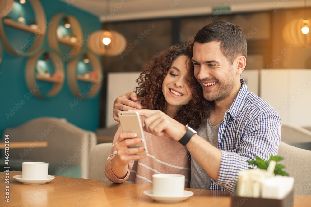 Nice looking couple in cafe Nice looking couple in cafe