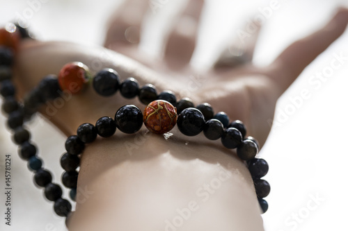 Woman's hand with a mala bracelet 