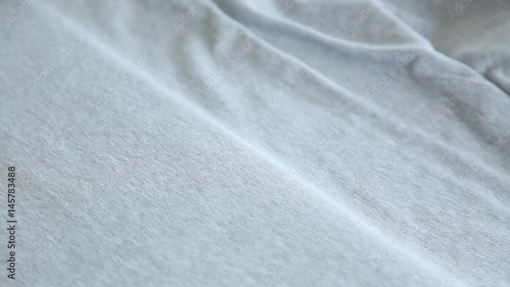 Woman at work in sewing factory. Close up of female hands cutting grey fabric with scissors. Real time full hd video footage. Woman at work in sewing factory. Close up of female hands cutting grey fabric with scissors. Real time full hd video footage.