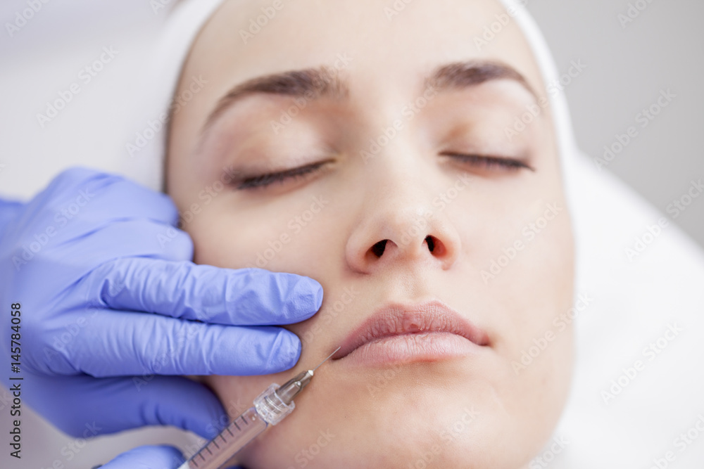 Young beautiful woman in the beauty salon on the face treatment Young beautiful woman in the beauty salon on the face treatment