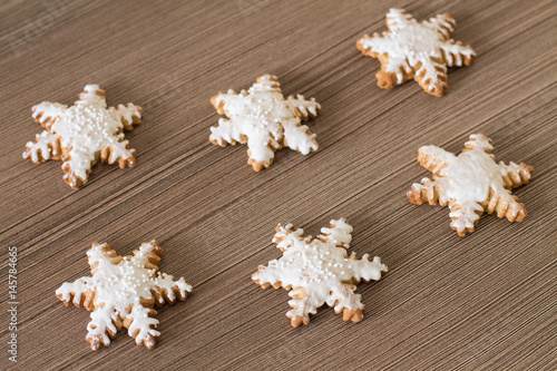 Wallpaper Mural Gingerbread snowflake on wood background. Aerial view. Torontodigital.ca