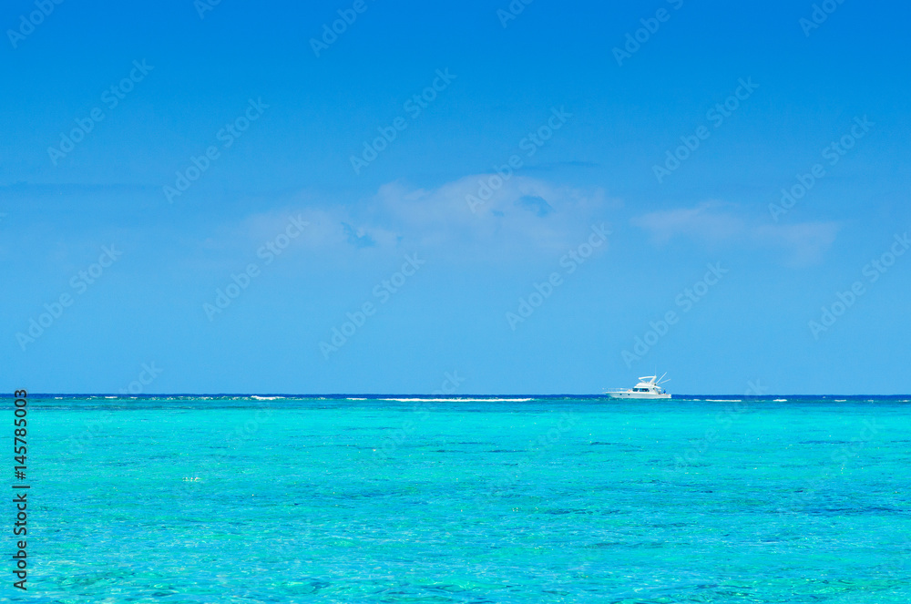 Alone boat on Idyllic beach on the coast of Mauritius