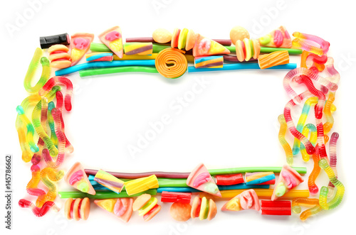 Frame made of colorful jelly candies on white background