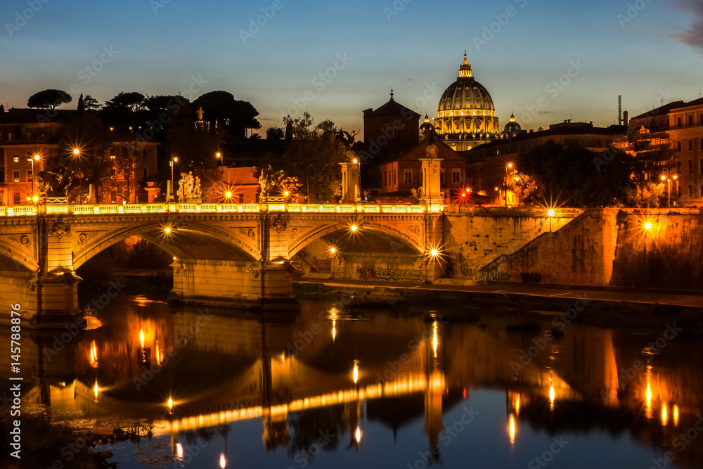 Night view on Tiber river and Saint Peter's Basilica in Vatican, Rome, Italy