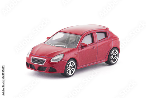 Red toy car on white background with clipping path