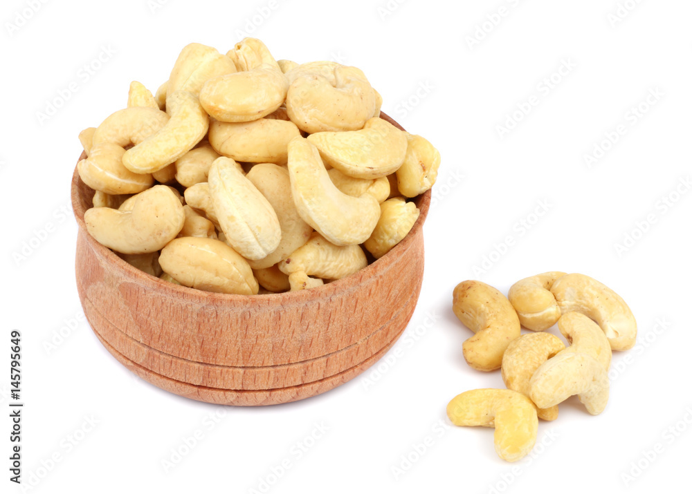 cashew in wood plate isolated on white background cashew in wood plate isolated on white background