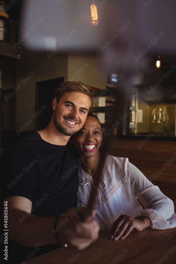Happy couple taking selfie from mobile phone Happy couple taking selfie from mobile phone