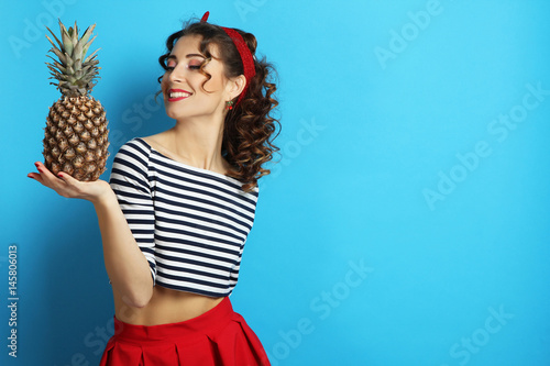 lwoman with pineapple. Pin up style. photo