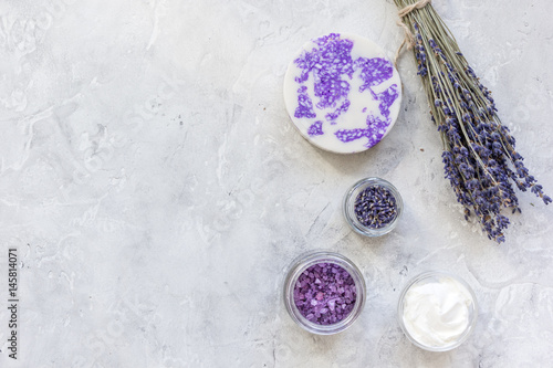 lavender flowers in organic cosmetic set on stone background top view mock-up