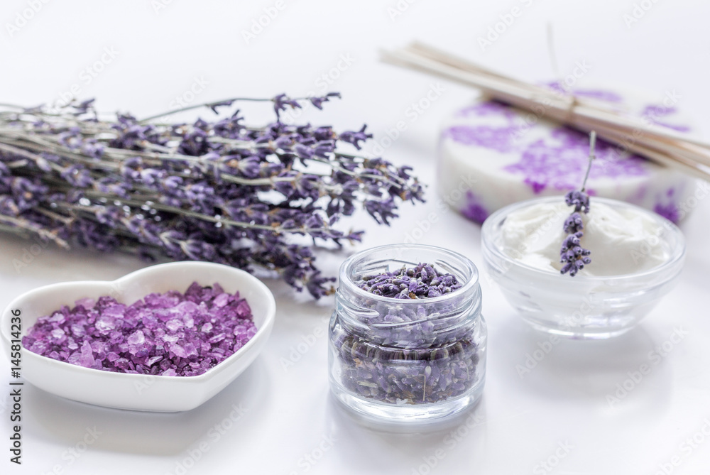 organic cosmetic with lavender flowers and bath salt on white background organic cosmetic with lavender flowers and bath salt on white background