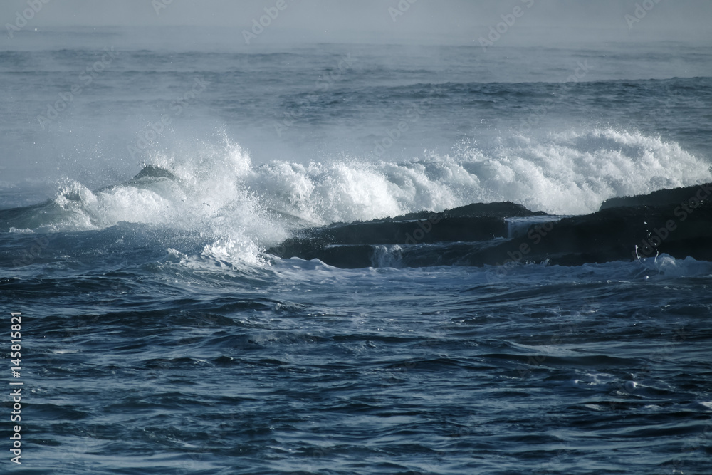 Big stormy ocean wave. Blue water background Big stormy ocean wave. Blue water background