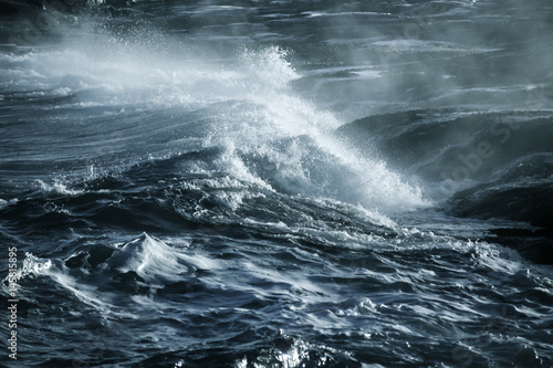 Big stormy ocean wave. Blue water background