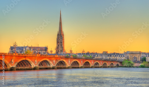 Pont de Pierre bridge and Saint Michel Basilica in Bordeaux, France