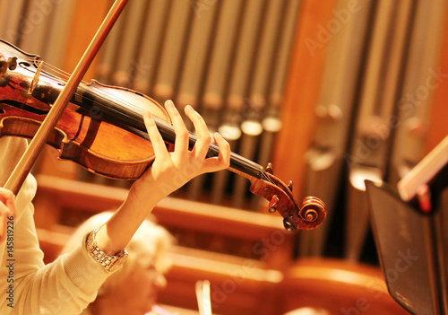 Woman playing the violin. Rehearsal Symphony orchestra.