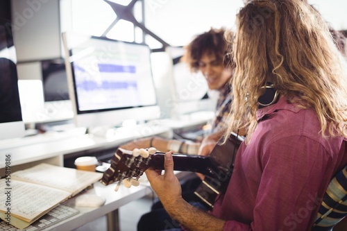 Two sound engineers working together photo