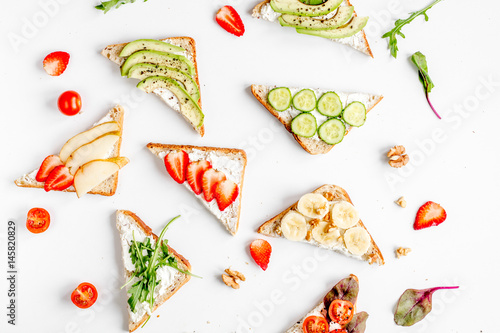 fitness breskfast with homemade sandwiches white table background top view photo