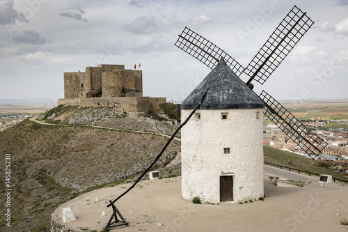 a windmill and the Castle in Consuegra town, province of Toledo, Castilla-La Mancha, Spain